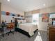 Well-lit bedroom featuring basketball theme decor and a comfortable desk area at 7636 Big Bend Blvd, Camby, IN 46113
