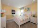 Bright bedroom with colorful decor, complemented by a white bed and matching nightstands at 7636 Big Bend Blvd, Camby, IN 46113