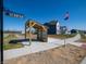 New homes in the community with a shelter by the sidewalk under a blue sky at 7636 Big Bend Blvd, Camby, IN 46113