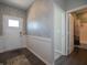 Bright entryway with paneled walls, stylish wallpaper, and access to a bathroom at 7636 Big Bend Blvd, Camby, IN 46113
