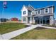 Charming two-story home featuring gray siding and a well-maintained lawn under a sunny sky at 7636 Big Bend Blvd, Camby, IN 46113