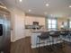 Well-lit kitchen with stainless steel appliances, granite countertops, a kitchen island with seating and an open design at 7636 Big Bend Blvd, Camby, IN 46113