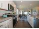 Modern kitchen featuring stainless steel appliances, granite countertops, and open layout at 7636 Big Bend Blvd, Camby, IN 46113