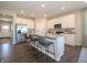Beautiful kitchen featuring stainless steel appliances, a large island with bar seating, and ample cabinet space at 7636 Big Bend Blvd, Camby, IN 46113