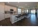 Modern kitchen with white cabinets, stainless steel appliances, granite countertops, and an island with seating at 7636 Big Bend Blvd, Camby, IN 46113