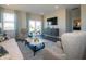 Stylish living room featuring modern decor, large windows, and comfortable seating at 7636 Big Bend Blvd, Camby, IN 46113