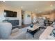 Comfortable living area with a large TV, stylish furniture, and an open layout at 7636 Big Bend Blvd, Camby, IN 46113