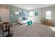 Bright living room featuring a cozy sofa, large windows, and modern decor at 7636 Big Bend Blvd, Camby, IN 46113