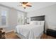 Bedroom features wood floor, a bed, big windows and neutral wall color at 7638 Beekman Ter, Zionsville, IN 46077