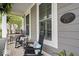 Inviting front porch with rocking chairs, a side table, and a plaque that reads 'The A D Hixon House' at 7638 Beekman Ter, Zionsville, IN 46077