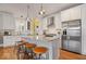 Kitchen with white cabinets, stainless steel appliances, a center island, and pendant lighting at 7638 Beekman Ter, Zionsville, IN 46077