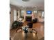 Cozy living room featuring a fireplace, seamless flow to kitchen, and coffered ceiling at 7638 Beekman Ter, Zionsville, IN 46077