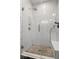 Modern shower features a frameless glass enclosure, subway tile surround, a shower bench and mosaic tile floor at 7638 Beekman Ter, Zionsville, IN 46077