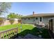 Lush backyard featuring a well-manicured lawn and a wood deck, perfect for relaxing or entertaining guests at 7735 E 50Th St, Indianapolis, IN 46226