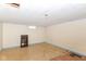 Unfinished basement space features a drop ceiling and a lonely shelf at 7735 E 50Th St, Indianapolis, IN 46226