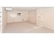 A finished basement offers versatile space with neutral carpet, storage closet, and a TV mount for entertainment at 7735 E 50Th St, Indianapolis, IN 46226