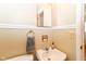 Traditional bathroom features a white sink, mirror, and classic fixtures for a clean and functional space at 7735 E 50Th St, Indianapolis, IN 46226