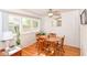 Bright dining room with hardwood floors, lots of natural light and contemporary ceiling fan at 7735 E 50Th St, Indianapolis, IN 46226