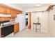 Traditional kitchen with wooden cabinets, tile backsplash, and modern appliances at 7735 E 50Th St, Indianapolis, IN 46226