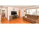 Cozy living area with hardwood flooring, faux fireplace, and natural light at 7735 E 50Th St, Indianapolis, IN 46226