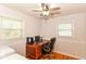 Home office space with ceiling fan, computer desk, natural light and wood floors at 7735 E 50Th St, Indianapolis, IN 46226