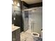Updated bathroom featuring a tiled shower and modern vanity at 801 N Denny St, Indianapolis, IN 46201