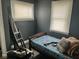 Small bedroom featuring a bed and two windows at 801 N Denny St, Indianapolis, IN 46201