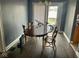 Dining area featuring wood floors and natural light with a patio walk-out at 801 N Denny St, Indianapolis, IN 46201