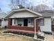 Modest home with a front porch needing some TLC at 801 N Denny St, Indianapolis, IN 46201