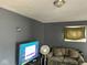A cozy living room with gray paint, a TV, and a comfortable couch at 801 N Denny St, Indianapolis, IN 46201