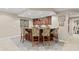 This basement features a bar with wood cabinets, four decorative chairs, and recessed lighting at 8027 Heyward Dr, Indianapolis, IN 46250