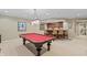 Finished basement with pool table, wet bar, and decorative lighting at 8027 Heyward Dr, Indianapolis, IN 46250