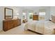 Bright bedroom with natural light from three large windows and classic wooden furniture at 8027 Heyward Dr, Indianapolis, IN 46250