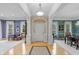 Elegant foyer featuring hardwood floors, white columns, chandelier, and grand entrance at 8027 Heyward Dr, Indianapolis, IN 46250