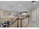 Spacious hallway with chandelier, leading to a well-lit office area with multiple work stations at 8027 Heyward Dr, Indianapolis, IN 46250