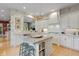 Spacious kitchen with an island, updated appliances, and eat-in breakfast bar at 8027 Heyward Dr, Indianapolis, IN 46250