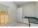 Office featuring a window for natural light, built-in cabinets, and tile floors at 8027 Heyward Dr, Indianapolis, IN 46250