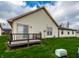 Backyard view showing the wood deck, lawn and siding at 8116 Heritage Commons Dr # Bldg 24, Indianapolis, IN 46219