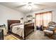 Comfortable bedroom with a dark wood bed frame and ample space at 8116 Heritage Commons Dr # Bldg 24, Indianapolis, IN 46219