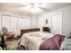Bright bedroom with ceiling fan, rocking chair, and neutral decor at 8116 Heritage Commons Dr # Bldg 24, Indianapolis, IN 46219