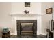 Elegant fireplace with a dark marble surround, a decorative mantel, and classic architectural details at 8116 Heritage Commons Dr # Bldg 24, Indianapolis, IN 46219