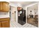 Open kitchen view to the living room, featuring a black refrigerator at 8116 Heritage Commons Dr # Bldg 24, Indianapolis, IN 46219
