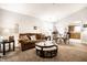 Cozy living room features plush seating, natural light, and an adjacent dining area with modern furnishings at 8116 Heritage Commons Dr # Bldg 24, Indianapolis, IN 46219
