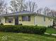 Charming single-story home with a well-maintained lawn and mature hedges at 8412 E 47Th St, Indianapolis, IN 46226