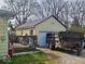 Detached one car garage with a flat driveway and small deck at 8412 E 47Th St, Indianapolis, IN 46226