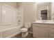 This bathroom features a tub and shower, a toilet, and a vanity with sink, providing a clean and functional space at 861 S Park Trail Dr, Carmel, IN 46032