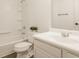 Clean and bright bathroom with white fixtures, including a tub-shower combo and a vanity sink at 861 S Park Trail Dr, Carmel, IN 46032
