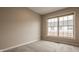 Cozy bedroom with neutral carpeting and a large window offering plenty of natural light at 861 S Park Trail Dr, Carmel, IN 46032