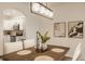This dining room features a wood table with seating for four and flows into the kitchen area, perfect for modern living at 861 S Park Trail Dr, Carmel, IN 46032