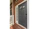 Elegant black front door with sidelight and transom, offering secure entry to the townhome at 861 S Park Trail Dr, Carmel, IN 46032